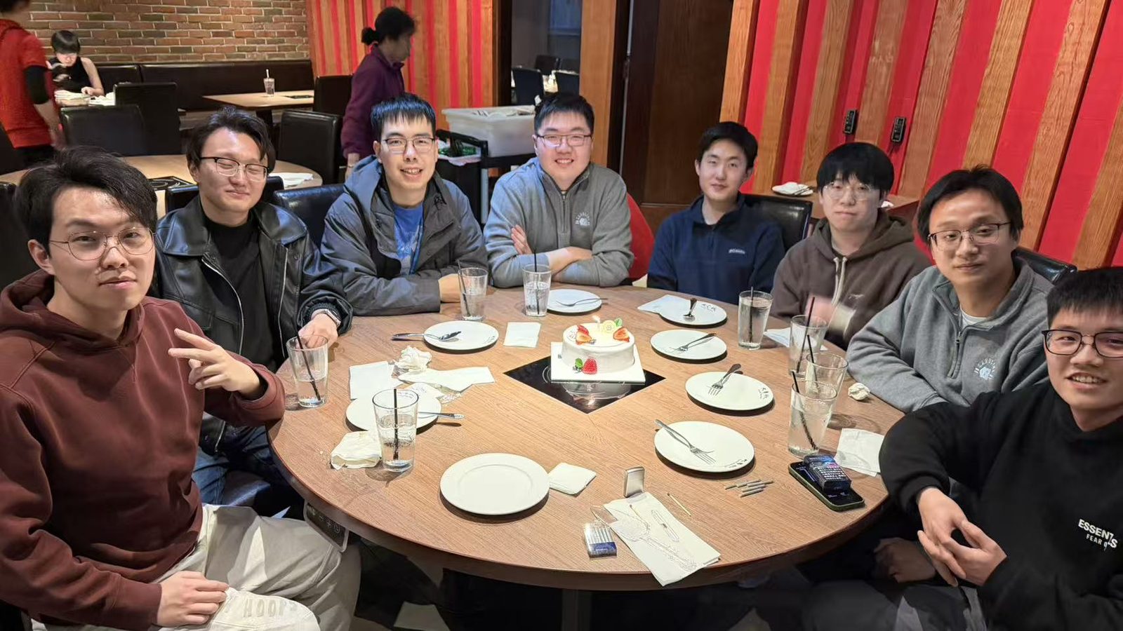 Lab members celebrating over dinner